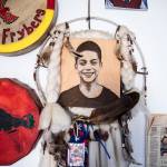 Photos and mementos of Andrew Fryberg hang on the wall inside his mothers home on Wednesday, in Tulalip. (Olivia Vanni / The Herald)