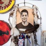 Photos and mementos of Andrew Fryberg hang on the wall inside his mothers home on Wednesday, July 13, 2022 in Tulalip, Washington. (Olivia Vanni / The Herald)