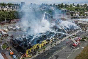 Smoke comes up from an apartment complex that caught fire along Marine View Drive on Thursday, July 16, 2020 in Everett, Wa. (Olivia Vanni / The Herald)