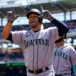 Seattle Mariners Eugenio Suarez reacts after hitting a three-run home run in the first inning of the first game of a doubleheader against the Washington Nationals on Wednesday in Washington. (AP Photo/Patrick Semansky)