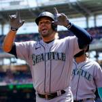 Seattle Mariners' Eugenio Suarez reacts after hitting a three-run home run in the first inning of the first game of a baseball doubleheader against the Washington Nationals, Wednesday, July 13, 2022, in Washington. (AP Photo/Patrick Semansky)
