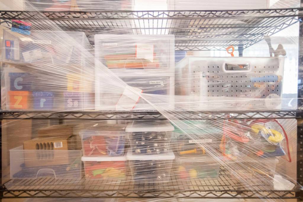 Items are packed and wrapped on a shelf at the Edmonds Library on Friday, in Edmonds. (Olivia Vanni / The Herald)