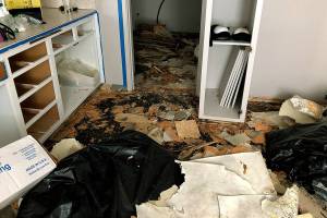 Derrick Boss, owner of Above and Beyond Asbestos Removal in Bothell, left 10 gallons of asbestos material on one customer’s floor. The customer had to hire another company to complete the work. (Washington State Office of the Attorney General)