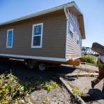 Nickel Bros workers prep the barge for the home to be loaded on Thursday, July 21, 2022 in Marysville, Washington. (Olivia Vanni / The Herald)