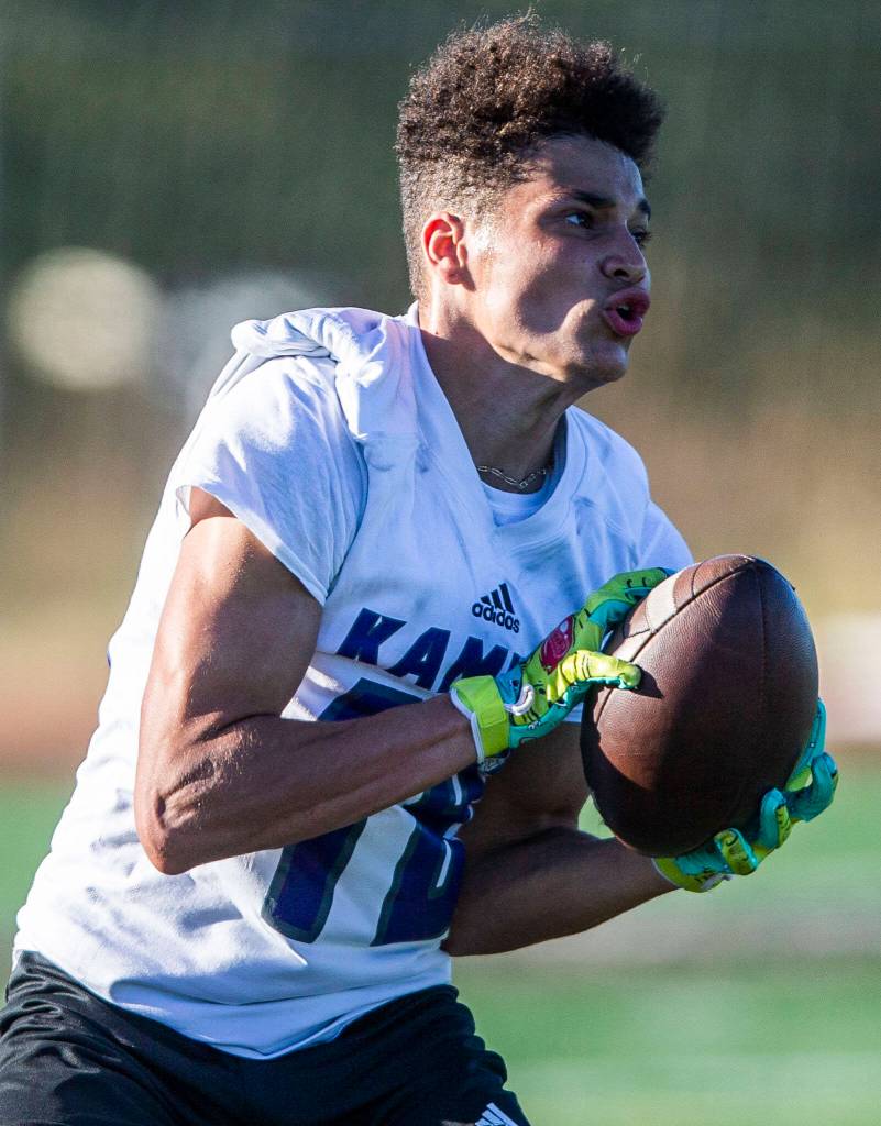A Kamiak player makes a catch during a 7on7 game at Glacier Peak High School on Wednesday, July 20, 2022 in Snohomish, Washington. (Olivia Vanni / The Herald)