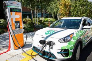 Two EV charging stations are unveiled at a ribbon cutting outside of PUD headquarters on Wednesday, July 13, 2022 in Everett, Washington. (Olivia Vanni / The Herald)