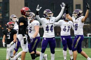 Members of the Lake Stevens offensive line celebrate a field goal against Eastlake at Pop Keeney Stadium on Saturday November 27, 2021.   (Andy Bronson / The Herald)