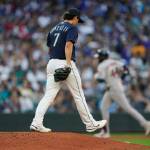 Seattle Mariners starting pitcher Marco Gonzales (7) stands on the mound as Houston Astros' Yordan Alvarez rounds the bases after hitting a solo home run during the fourth inning of a baseball game, Friday, July 22, 2022, in Seattle. (AP Photo/Ted S. Warren)