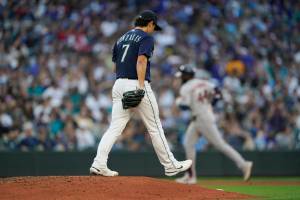 Seattle Mariners starting pitcher Marco Gonzales (7) stands on the mound as Houston Astros' Yordan Alvarez rounds the bases after hitting a solo home run during the fourth inning of a baseball game, Friday, July 22, 2022, in Seattle. (AP Photo/Ted S. Warren)
