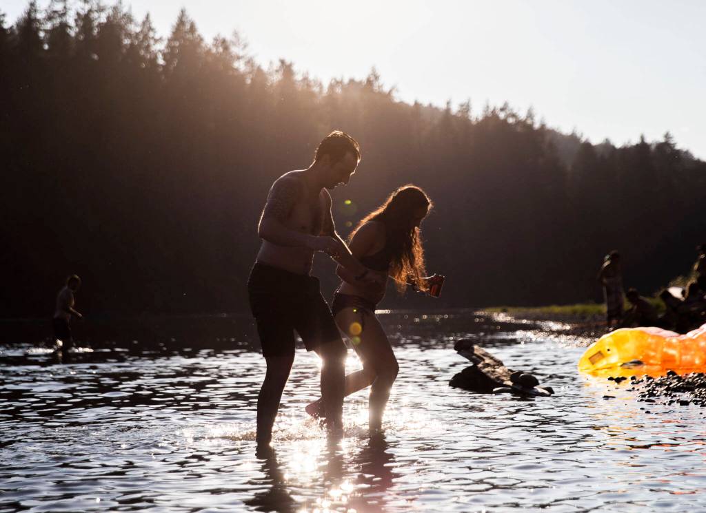 People enjoy the river access at Summer Meltdown on Thursday, in Snohomish. (Olivia Vanni / The Herald)