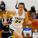 Alington’s Jenna Villa takes the ball up the court against Everett Tuesday, Feb. 15, 2022, at Marysville Pilchuck High School in Marysville, Washington. (Ryan Berry / The Herald)