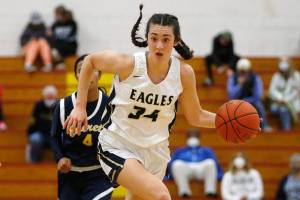 Alington’s Jenna Villa takes the ball up the court against Everett Tuesday, Feb. 15, 2022, at Marysville Pilchuck High School in Marysville, Washington. (Ryan Berry / The Herald)