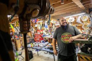 Josh Haazard Stands inside his workspace, the HaazLab, where he creates a variety of cosplay props and other creative gadgets, on Thursday, Aug. 4, 2022, at his home in Monroe, Washington. (Ryan Berry / The Herald)