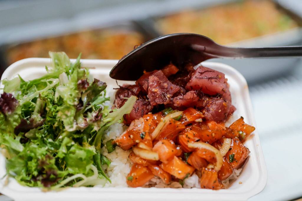 Garlic furikake salmon and traditional ahi on sushi rice served with salad at Ono Poke in Edmonds. (Kevin Clark / The Herald)