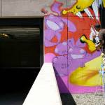 Jason Clifton, of Ellensburg, works on a mural on Friday, Aug. 5, 2022, in downtown Everett, Washington. (Ryan Berry / The Herald)