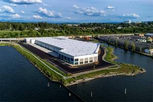 OnTrac Logistics has leased a building now under construction at Bay Wood Business Park on Everett's waterfront. The shipping company will open a facility there later this year that will employ 400 people. (Artist Rendering/Broderick Group.)