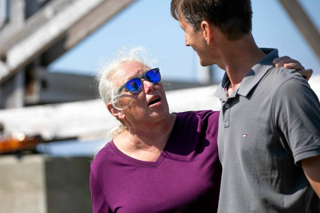 Martha Rasmussen thanks Carson Tavenner during the official reopening ceremony of the North Mountain Fire Lookout Wednesday, Aug. 10, north of Darrington. (Ryan Berry / The Herald)