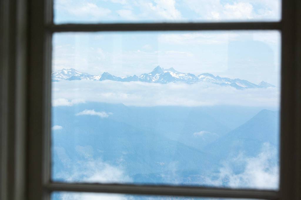A far off peak is visible from the North Mountain Fire Lookout on Wednesday, Aug. 10, north of Darrington. (Ryan Berry / The Herald)