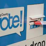 A person puts their ballot in a drop box on Oct. 27, 2020, at a library in Seattle. (AP Photo / Ted S. Warren, File)