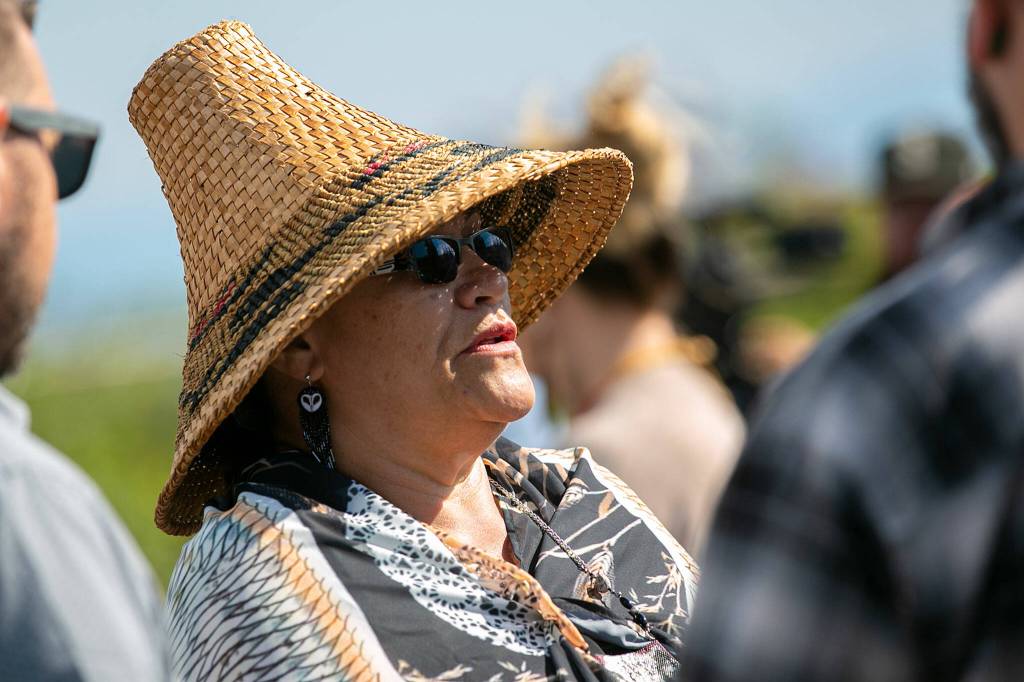 Teri Gobin, Chairwoman of the Tulalip Tribes, speaks with attendees before a blessing ceremony Monday, at the decommissioned NOAA building on the waterfront in Mukilteo. (Ryan Berry / The Herald)