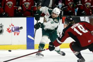 The Everett Silvertips’ Ronan Seeley tries a slap shot against the Vancouver Giants during the first round of the WHL playoffs Friday, April 22, 2022, at Angel of the Winds Arena in Everett, Washington. (Ryan Berry / The Herald)