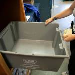 Food Bank Coordinator Kaitlyn Taylor puts away an empty tote that is typically filled to the brim with ramen noodles while packing boxes on Friday, at the Everett Food Bank on Broadway in Everett. Taylor has only worked at the food bank since the spring, but said she has seen a steady decline in donations ever since she started working there. (Ryan Berry / The Herald)