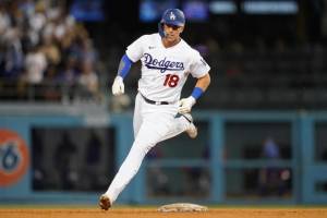 Los Angeles Dodgers' Jake Lamb (18) runs the bases after hitting a home run during the seventh inning of a baseball game against the Chicago Cubs in Los Angeles, Saturday, July 9, 2022. (AP Photo/Ashley Landis)