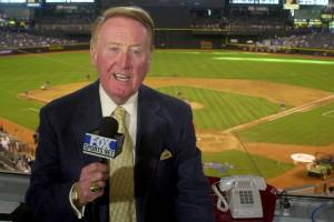 FILE - Los Angeles Dodgers television play-by-play announcer Vin Scully rehearses before a baseball game between the Dodgers and the Arizona Diamondbacks in Phoenix on July 3, 2002. Scully, whose dulcet tones provided the soundtrack of summer while entertaining and informing Dodgers fans in Brooklyn and Los Angeles for 67 years, died Tuesday night, Aug. 2, 2022, the team said. He was 94. (AP Photo/Paul Connors, File)