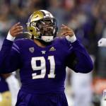 Washington's Tuli Letuligasenoa reacts after a play against California in an NCAA college football game Saturday, Sept. 25, 2021, in Seattle. (AP Photo/Elaine Thompson)