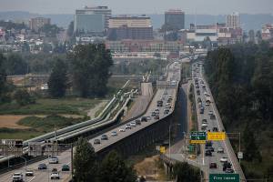 Afternoon traffic moves along the U.S. 2 trestle between Everett and Lake Stevens on Thursday, Aug. 12, 2021 in Everett, Wash. (Olivia Vanni / The Herald)