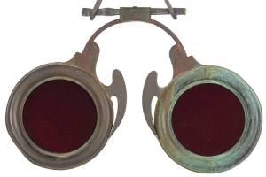 Antique trade signs are especially desirable when they double as folk art. This optician's sign, shaped like a pair of red lenses in a metal frame, could be an interesting, if expensive, decoration.