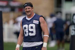 Seattle Seahawks tight end Will Dissly stretches during NFL football practice Monday, Aug. 1, 2022, in Renton, Wash. (AP Photo/Ted S. Warren)