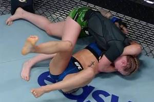 Cory McKenna (top) tries to submit Miranda Granger during a UFC mixed martial arts match on Aug. 6, 2022, in Las Vegas. (Photo via ESPN MMA)