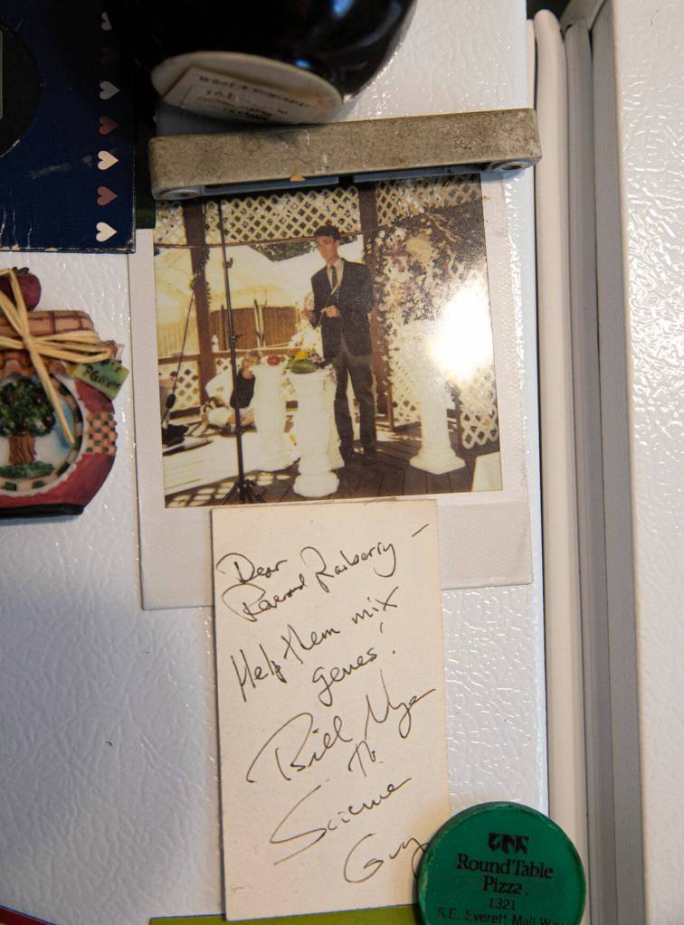 An autographed photo of Bill Nye the Science Guy hangs on the fridge in Rev. Barbara Rasberrys home. Nye filmed a segment at the Purple Wedding Chapel for his show The Eyes of Nye in which he officiated the marriage between domesticated wheat and wild wheat. (Ryan Berry / The Herald)