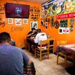 People enjoy lunch at Rinconcito Peruano Restaurant on Saturday, in Lynnwood. (Olivia Vanni / The Herald)