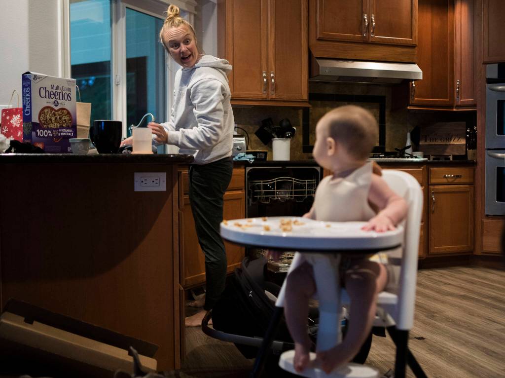 Making breakfast at home, Miranda Granger makes a funny face at her daughter Austin on Monday, Feb. 28, 2022, in Lake Stevens, Washington. (Olivia Vanni / The Herald)