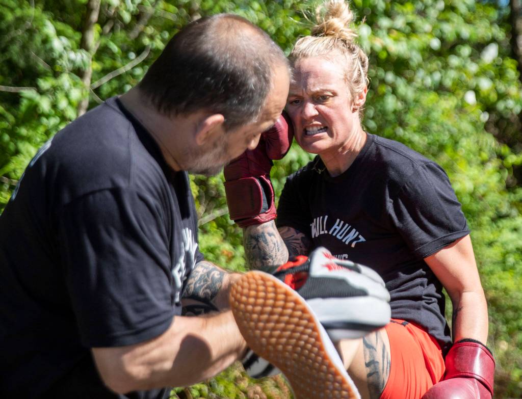 Scowling, Miranda Granger hits a round kick in one of her final training sessions on Tuesday, July 12, 2022, weeks before she headed to Las Vegas for a UFC fight. (Olivia Vanni / The Herald)