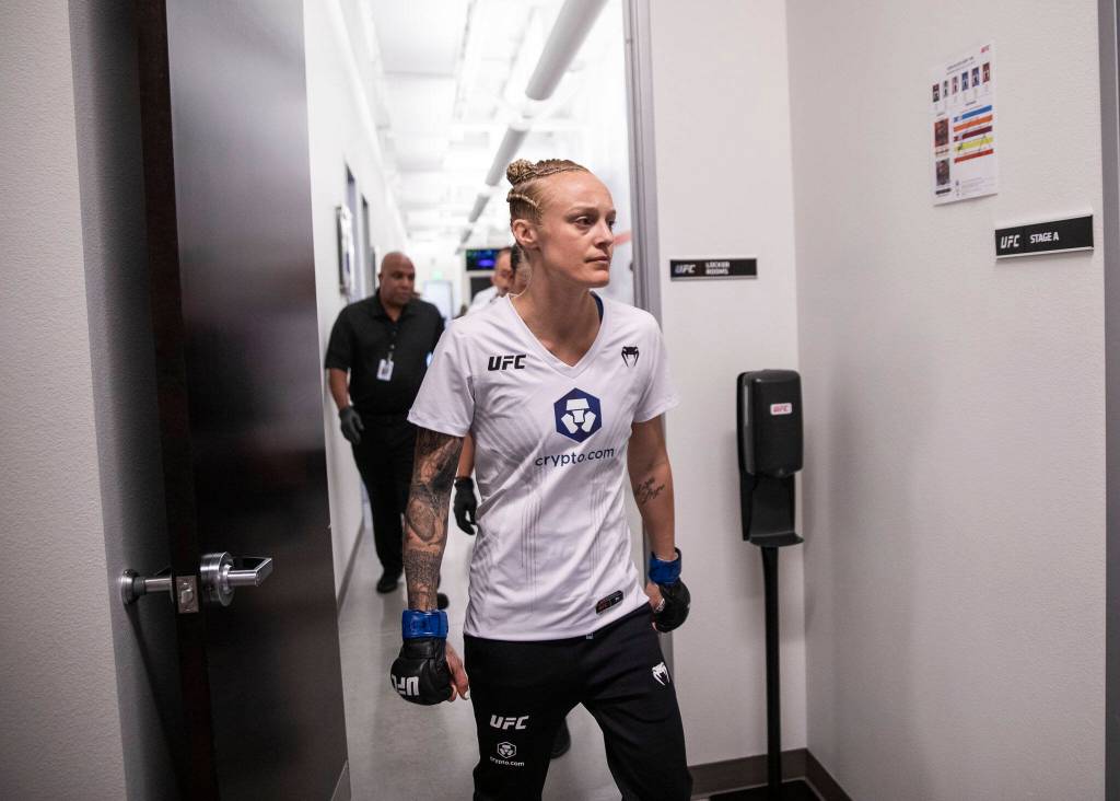 Miranda Granger is escorted down a hallway by security as she makes her way to the Octagon for her fight on Saturday, Aug. 6, 2022, in Las Vegas. (Olivia Vanni / The Herald)