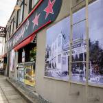 An old photograph is visible along the outside of Woodys along Highway 99 in Shoreline. (Olivia Vanni / The Herald)