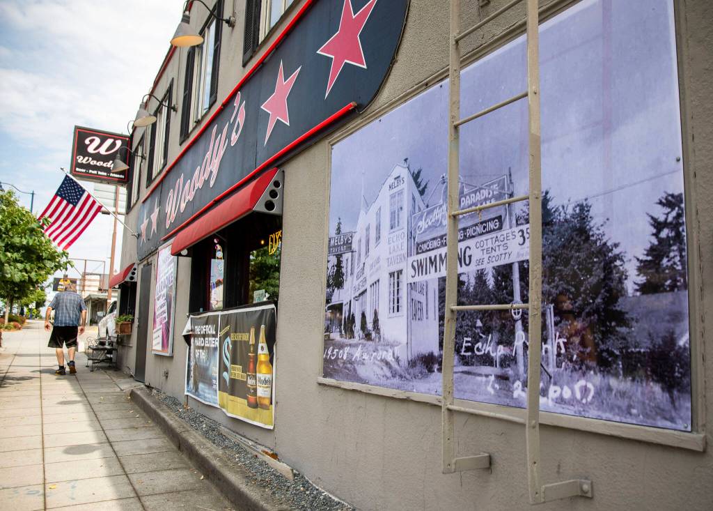 An old photograph is visible along the outside of Woodys along Highway 99 in Shoreline. (Olivia Vanni / The Herald)