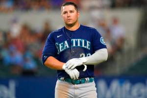 Seattle Mariners Ty France walks on the field during a baseball game against the Texas Rangers in Arlington, Texas, Sunday, Aug. 14, 2022. (AP Photo/LM Otero)