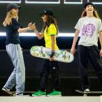 Keet Oldenbeuving, left, congratulates Rayssa Leal, center, after a run during the Street League Skateboarding womens final on Sunday, Aug. 14, 2022 in Everett, Washington. (Olivia Vanni / The Herald)