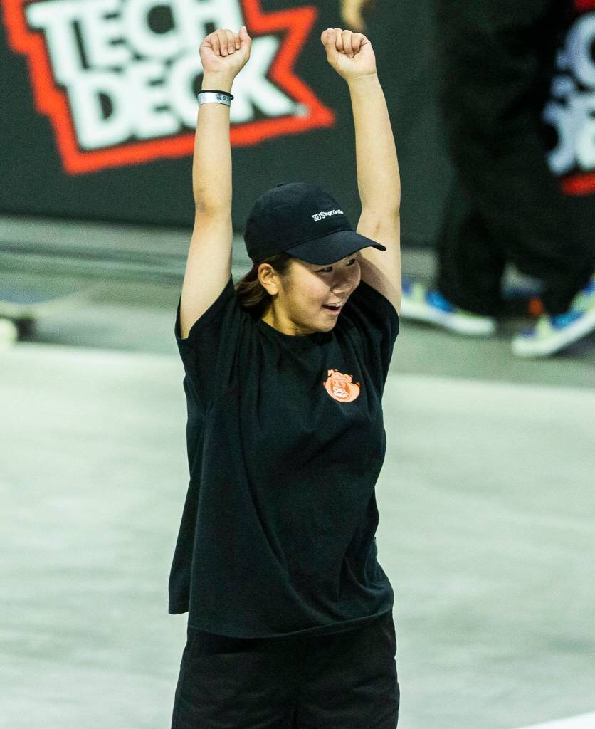 Yuemka Oda celebrates after landing a trick during the Street League Skateboarding womens final on Sunday, Aug. 14, 2022 in Everett, Washington. (Olivia Vanni / The Herald)