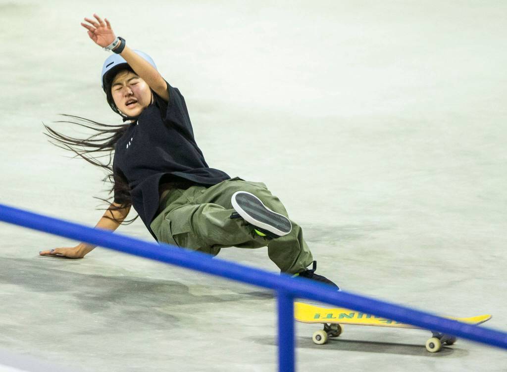 Funa Nakayama of Japan wipes out after a trick during the Street League Skateboarding womens final on Sunday, Aug. 14, 2022 in Everett, Washington. (Olivia Vanni / The Herald)