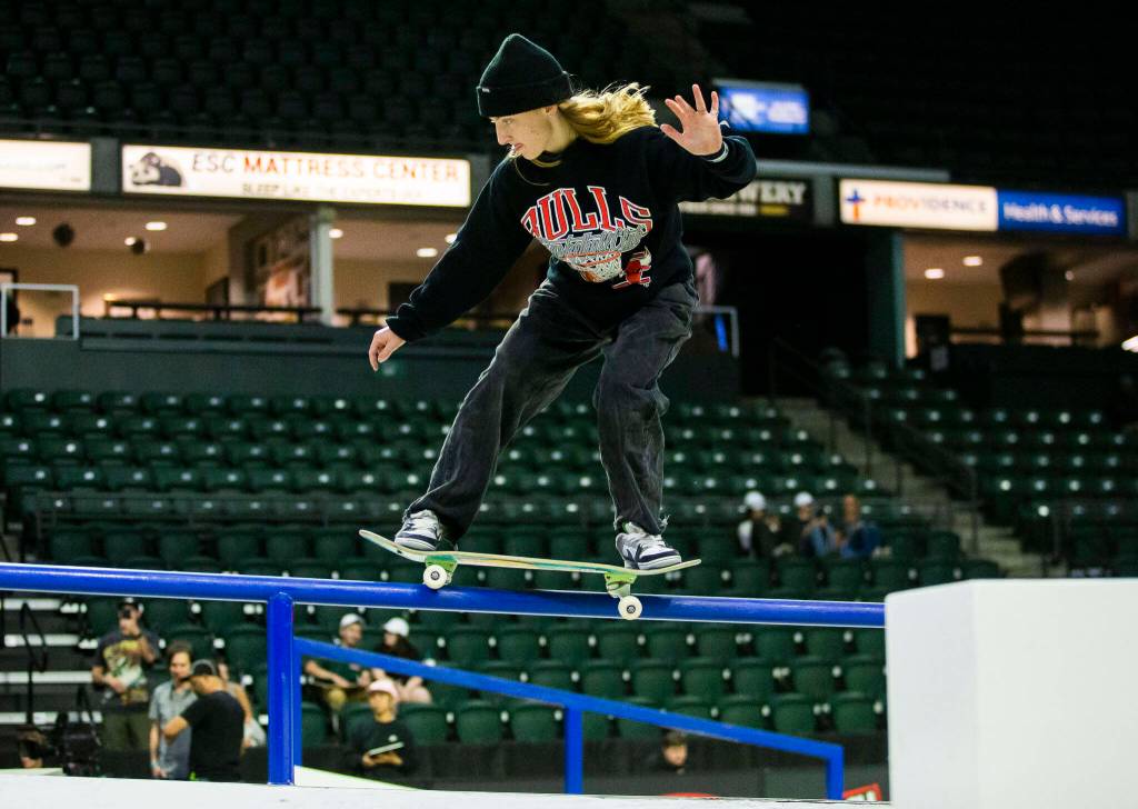 Poe Pinson railslides during a warm up before the start of the Street League Skateboarding womens final on Sunday, Aug. 14, 2022 in Everett, Washington. (Olivia Vanni / The Herald)