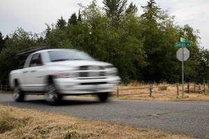 A car drives along Dakota Way on Thursday, Aug. 18, 2022 in Everett, Washington. (Olivia Vanni / The Herald)
