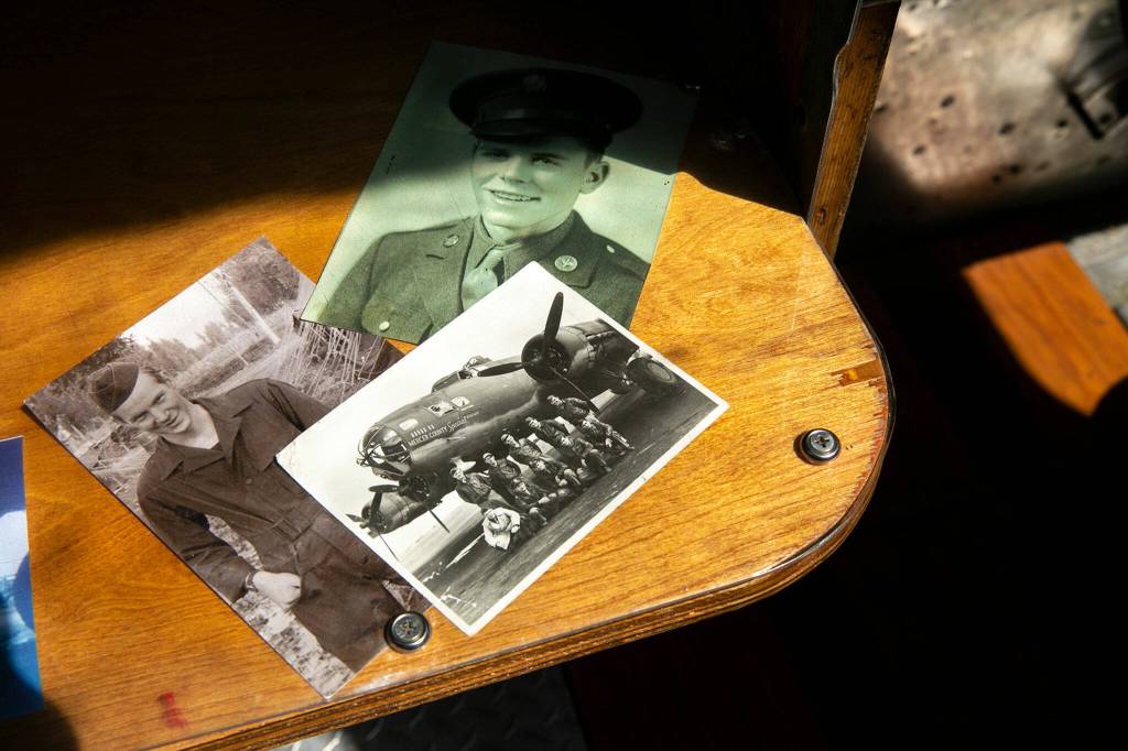 Photos and other historic documents are scattered throughout the interior of Sentimental Journey on Monday, at Arlington Municipal Airport in Arlington. (Ryan Berry / The Herald)