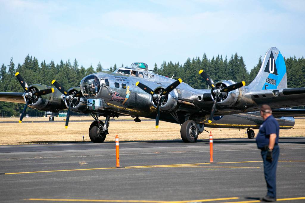 Sentimental Journey, a Boeing B-17 Flying Fortress, taxis in after landing Monday, at Arlington Municipal Airport in Arlington. (Ryan Berry / The Herald)