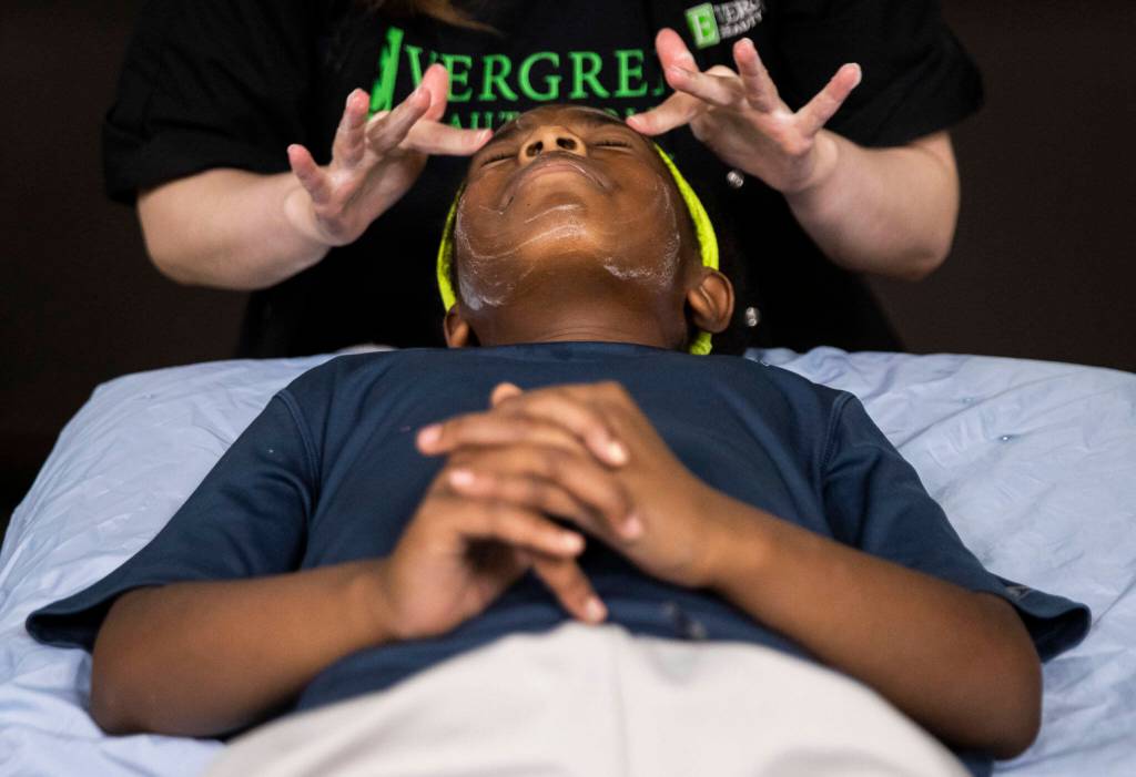 Layla Wright, 9, gets a facial during Evergreen Beauty Colleges annual back-to-school beauty event on Wednesday, in Everett. (Olivia Vanni / The Herald)