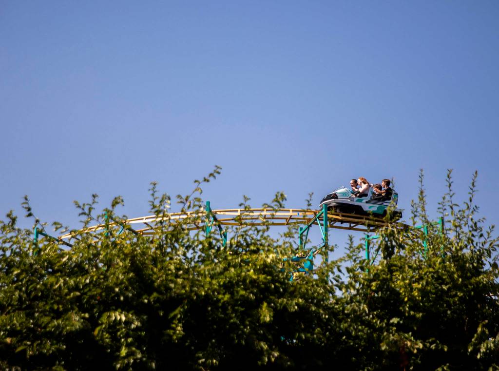 People ride a roller coaster during opening day of the Evergreen State Fair on Thursday, in Monroe. (Olivia Vanni / The Herald)